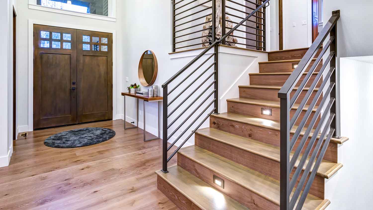 Metal handrail installed along modern staircase