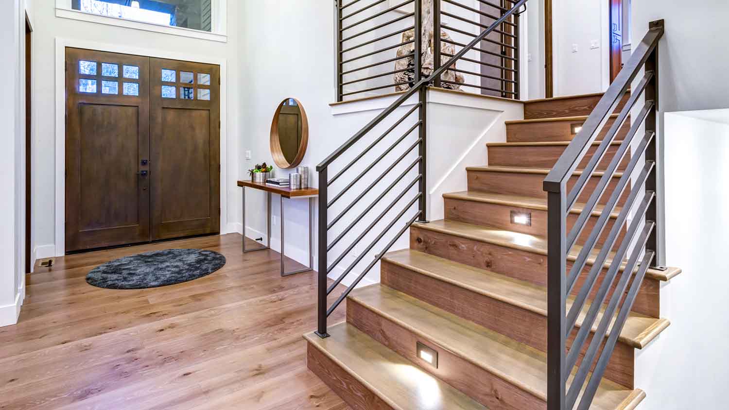 Metal handrail installed along modern staircase 