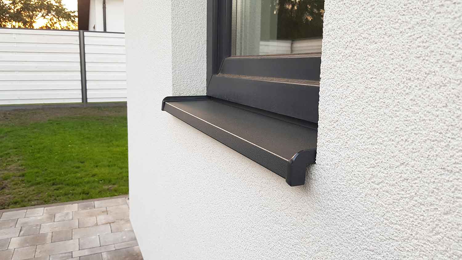 Metal window sill installed outside of the house 
