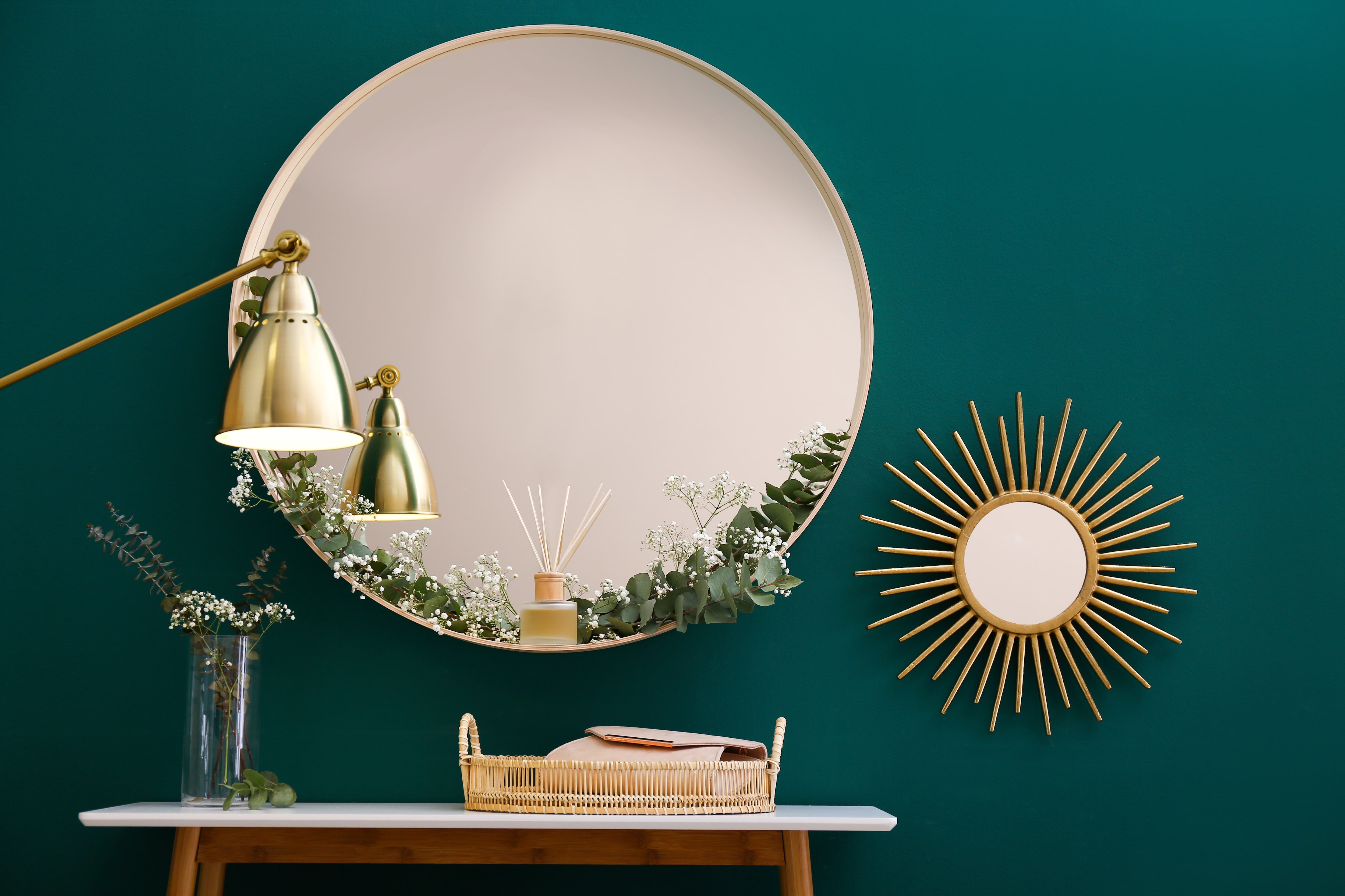 Round mirrors, lamp, and table in modern living room