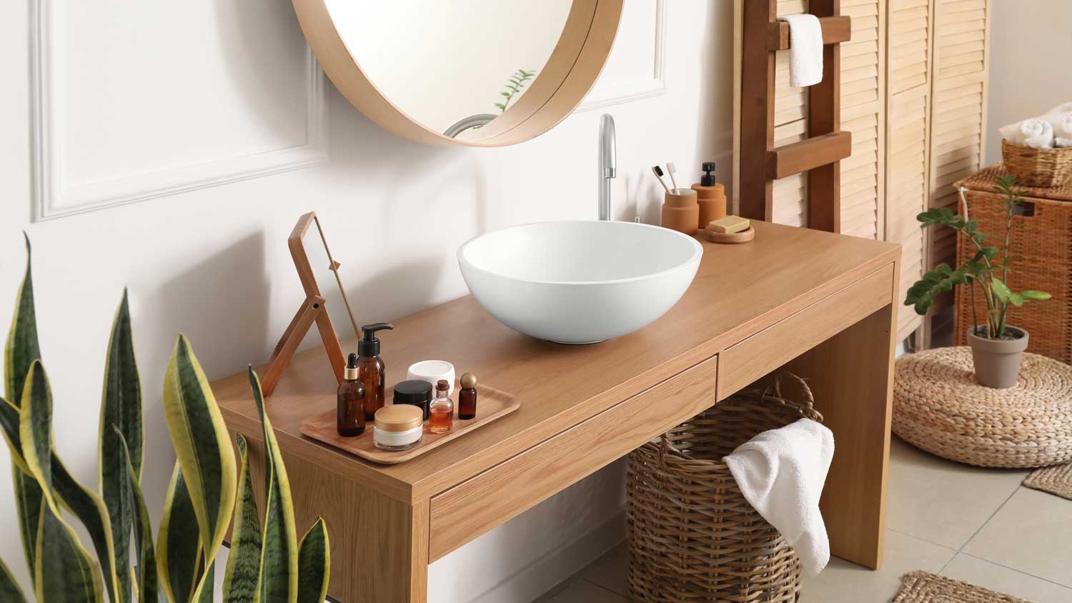 A minimal bathroom with a wooden table and a white sink