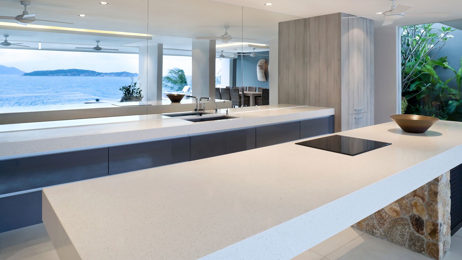 Minimalist kitchen with large concrete countertops