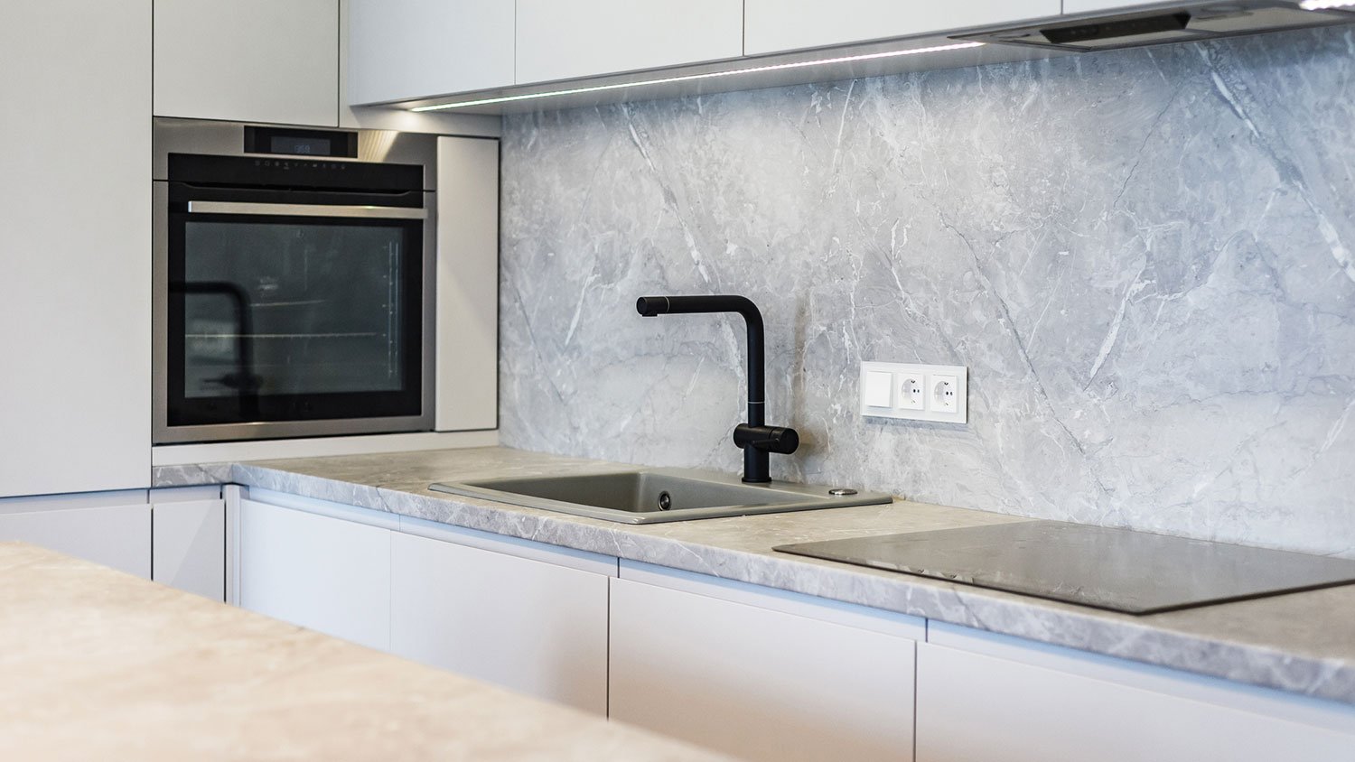 Minimalistic kitchen with stone countertops