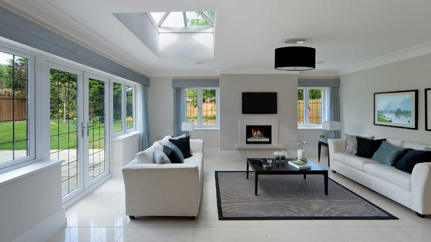A minimalistic living room with a skylight
