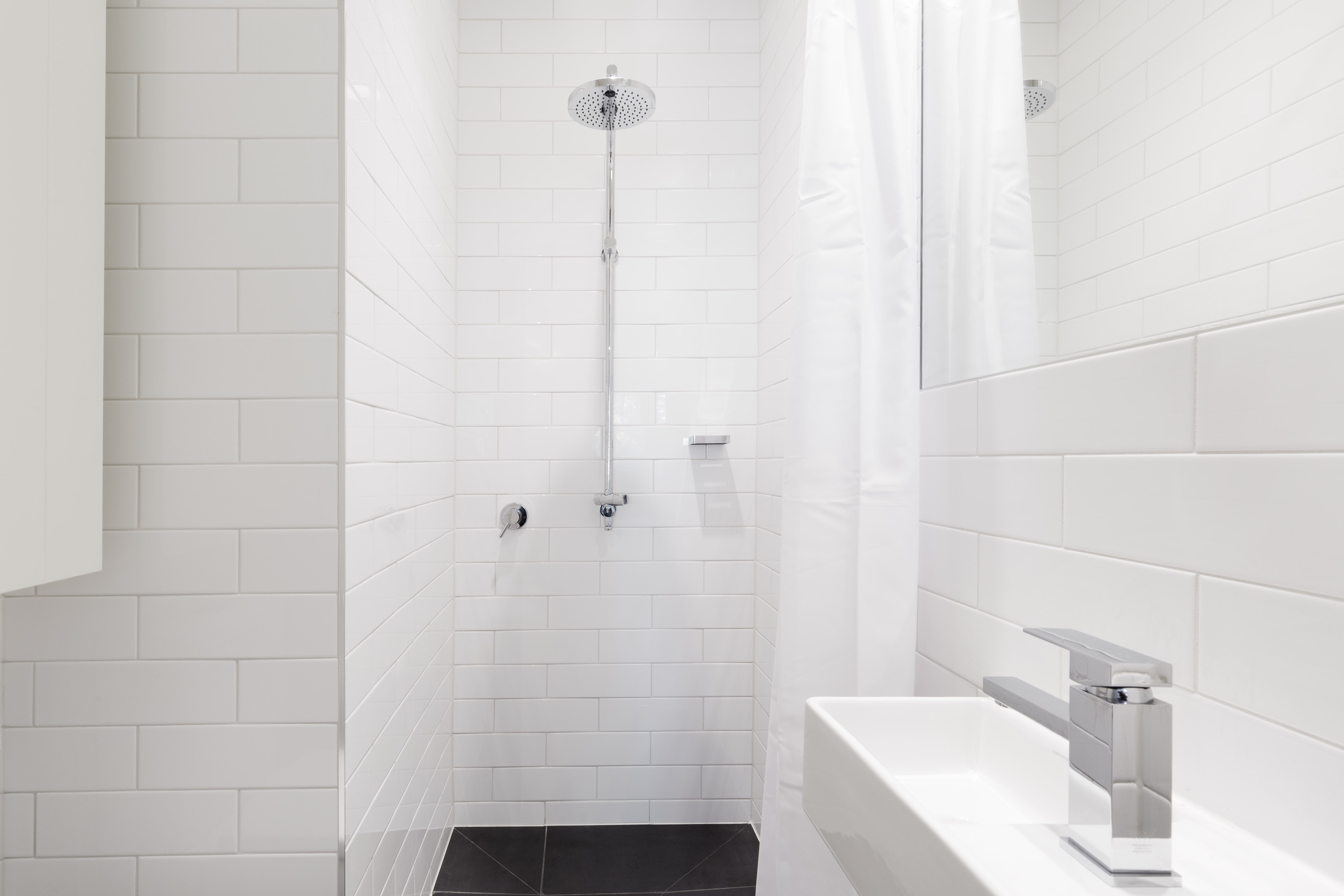 All-white minimalist small modern bathroom