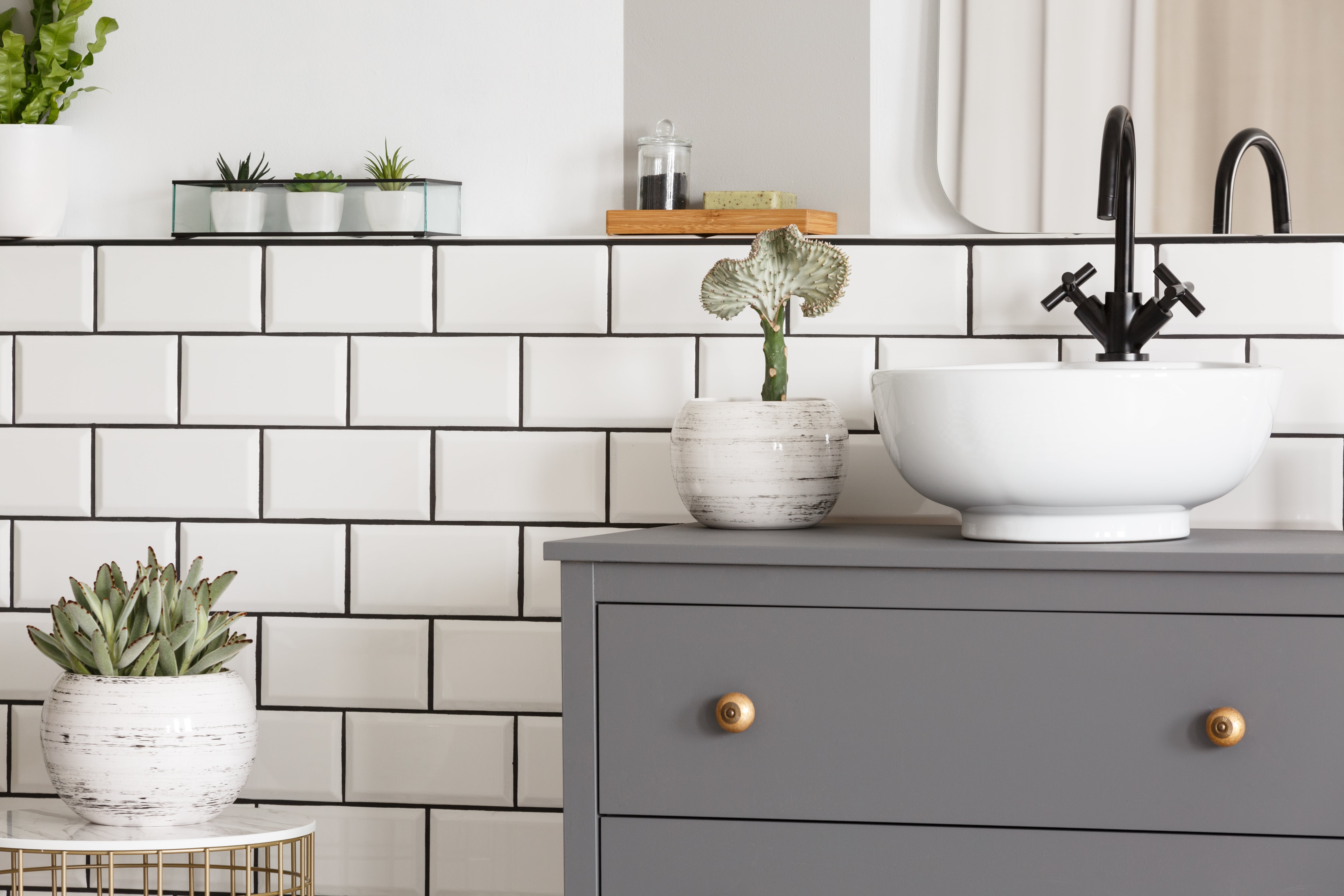 Small modern bathroom with a closeup of vanity