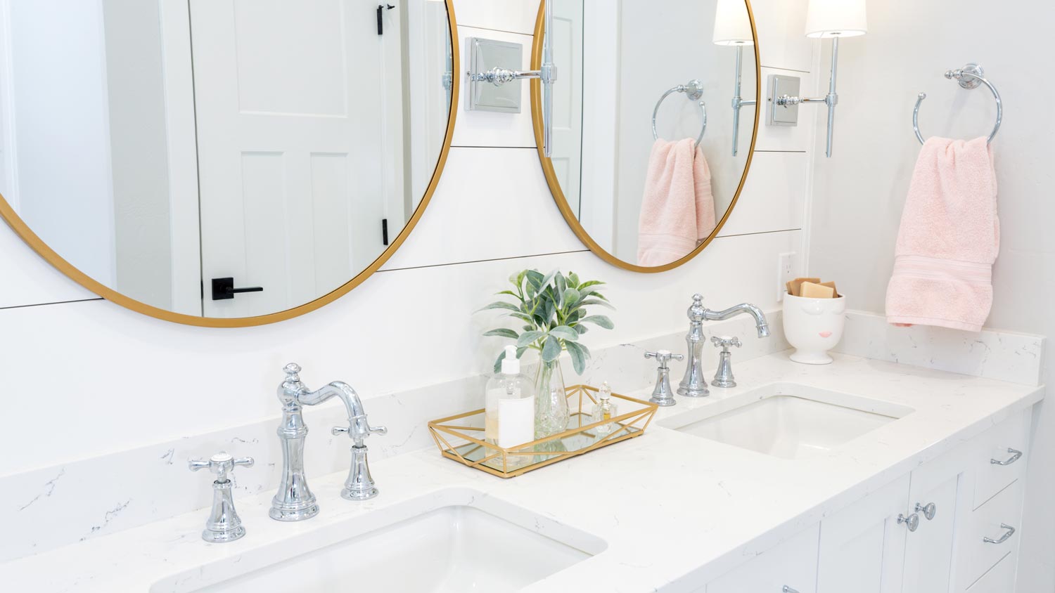 An all-white modern bathroom with shiplap on the wall