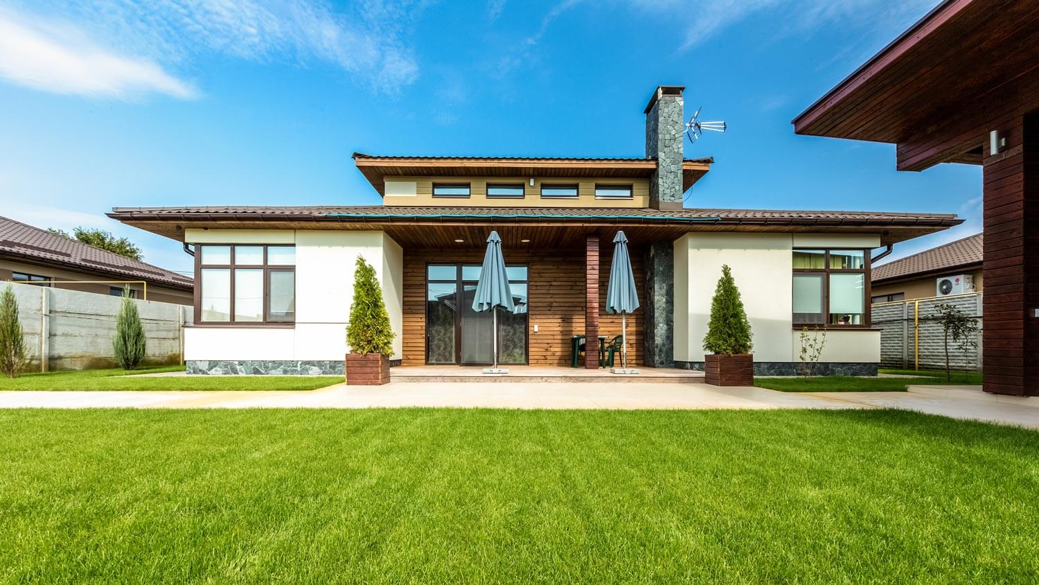 A modern cement house with lawn