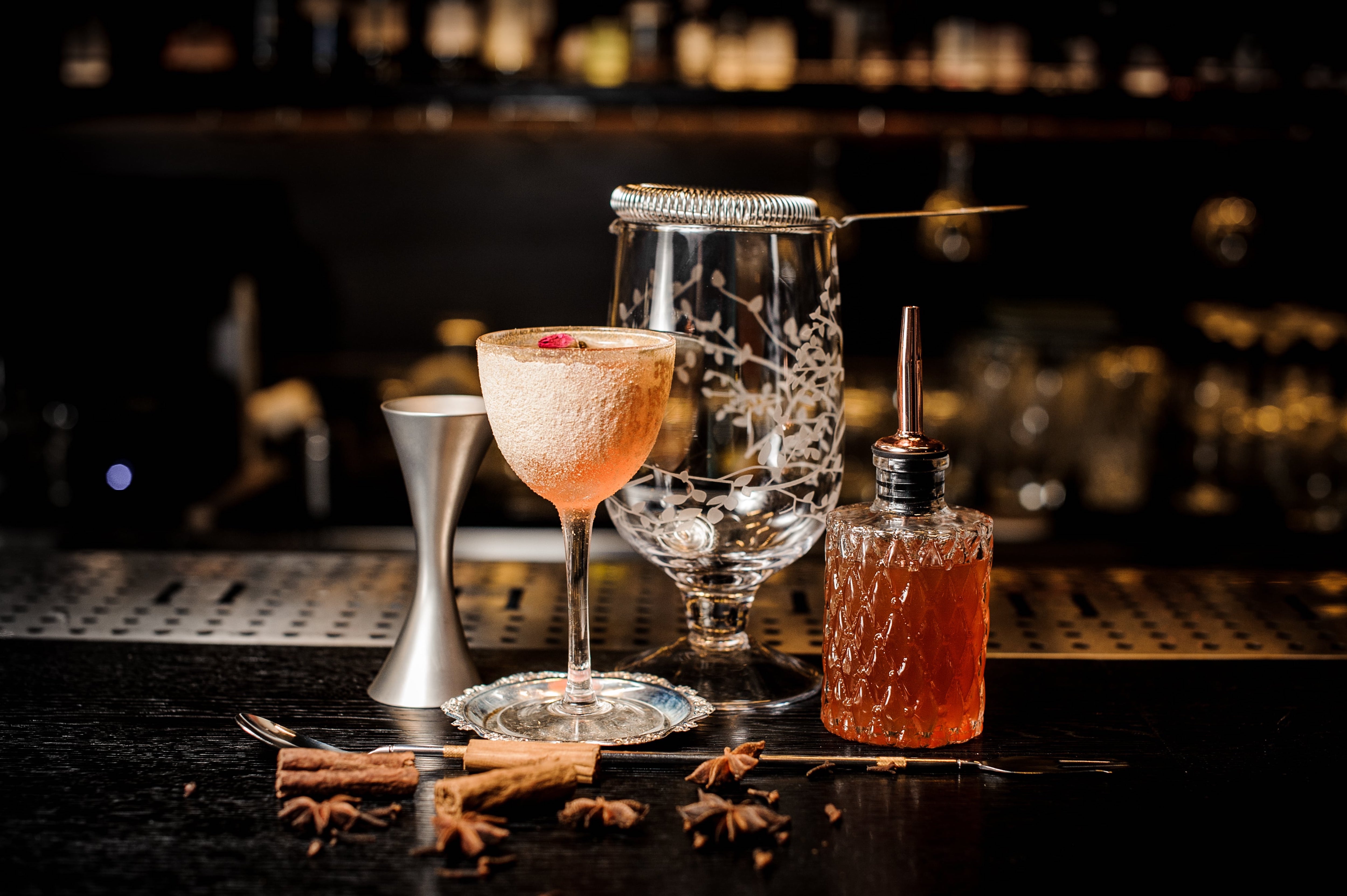 Cocktail glasses and drinks on bar counter