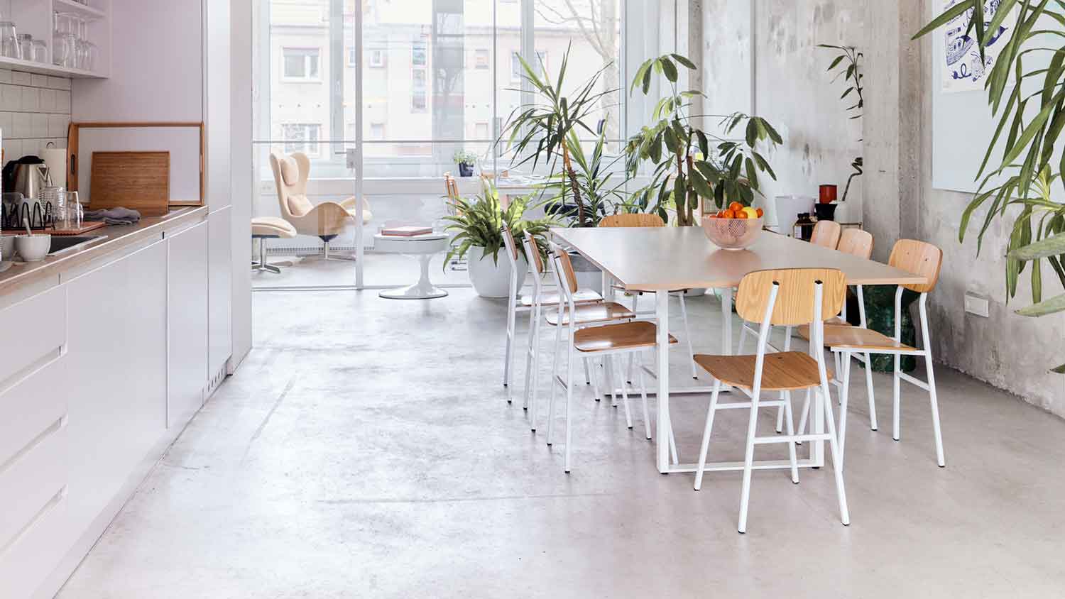 Modern dining room with concrete flooring