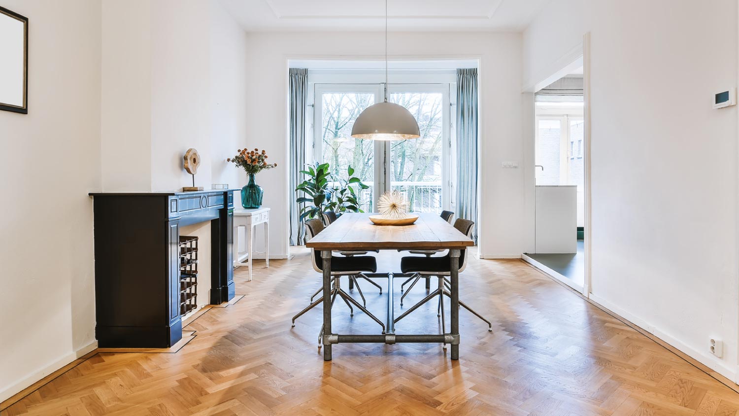 A modern dining room with white walls