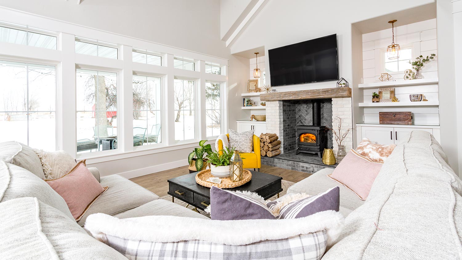 Modern farmhouse with winter view outside the windows