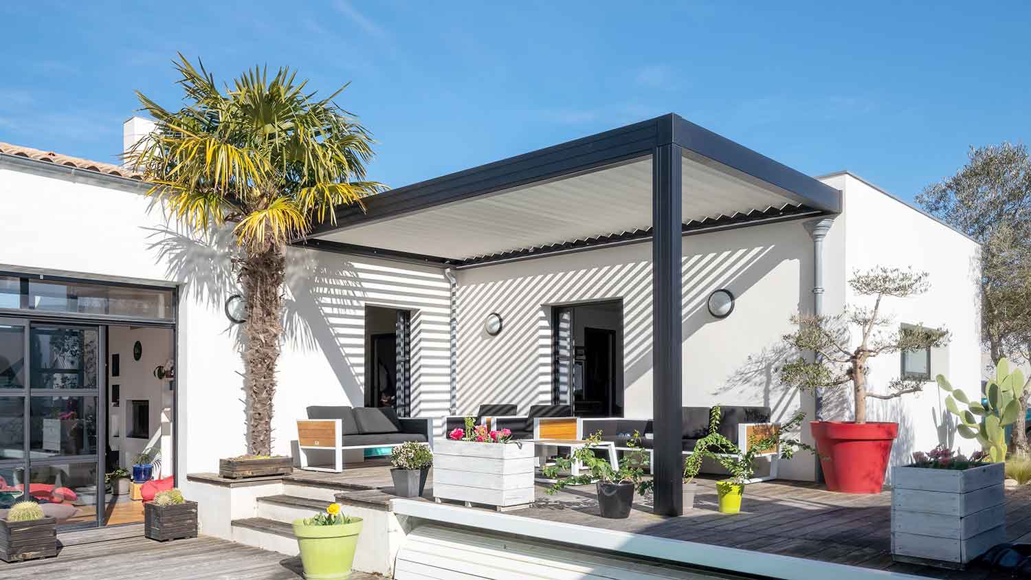 House exterior with modern pergola installed on the patio