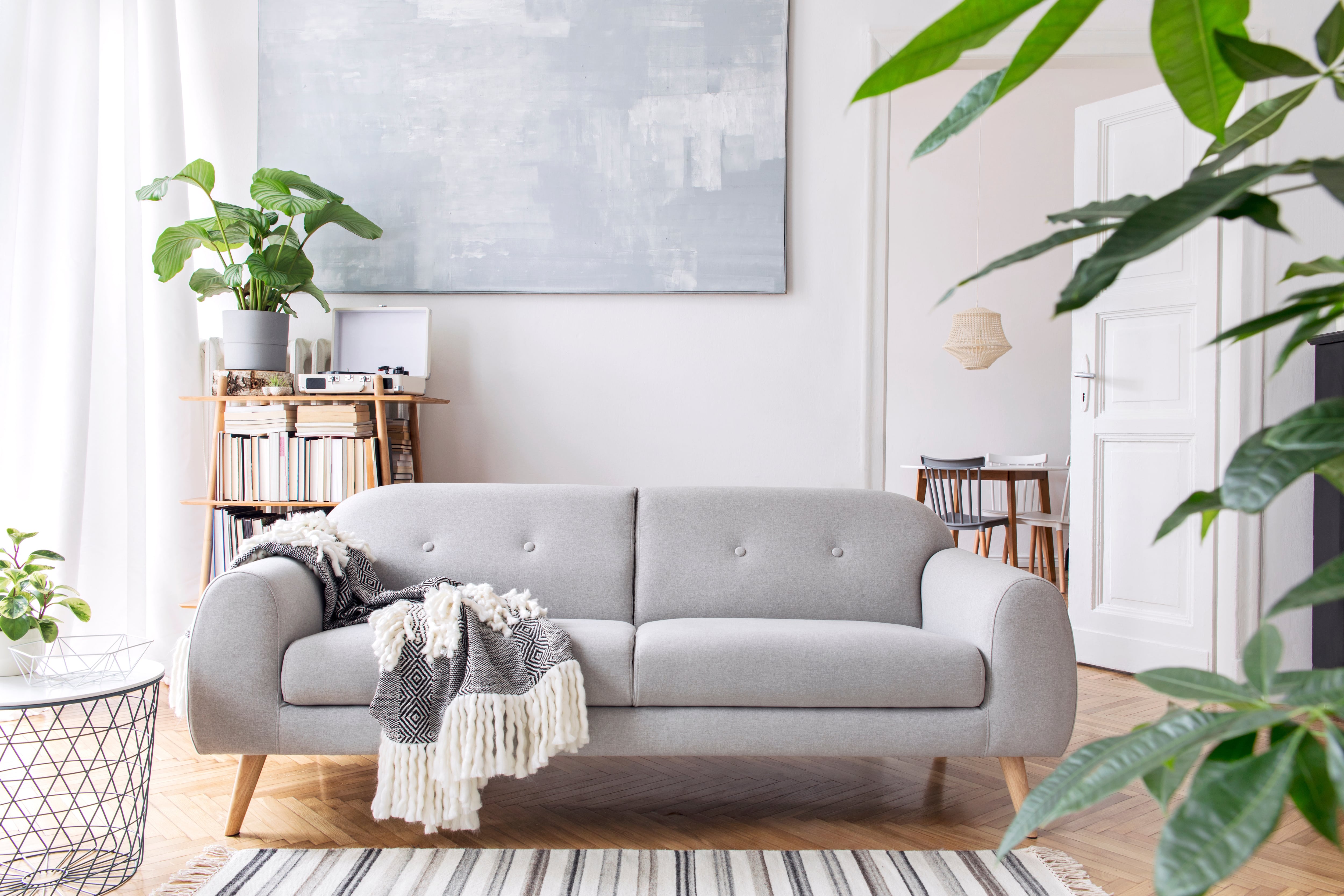 A simple living room with Scandinavian style couch and minimalist design