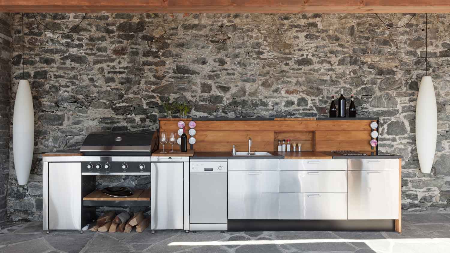 A modern outdoor kitchen with stainless steel appliances