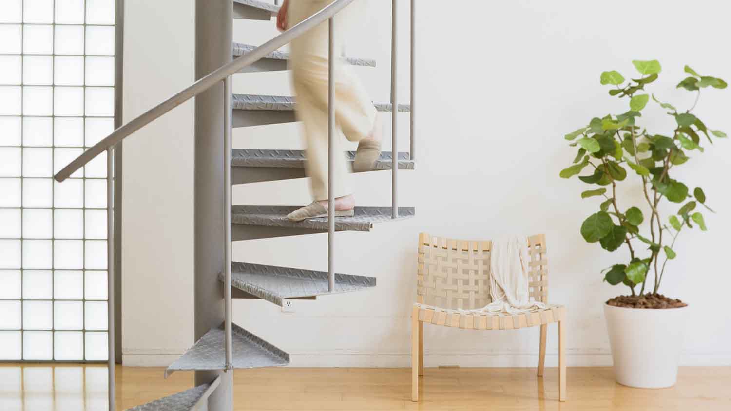 Person going down a spiral staircase