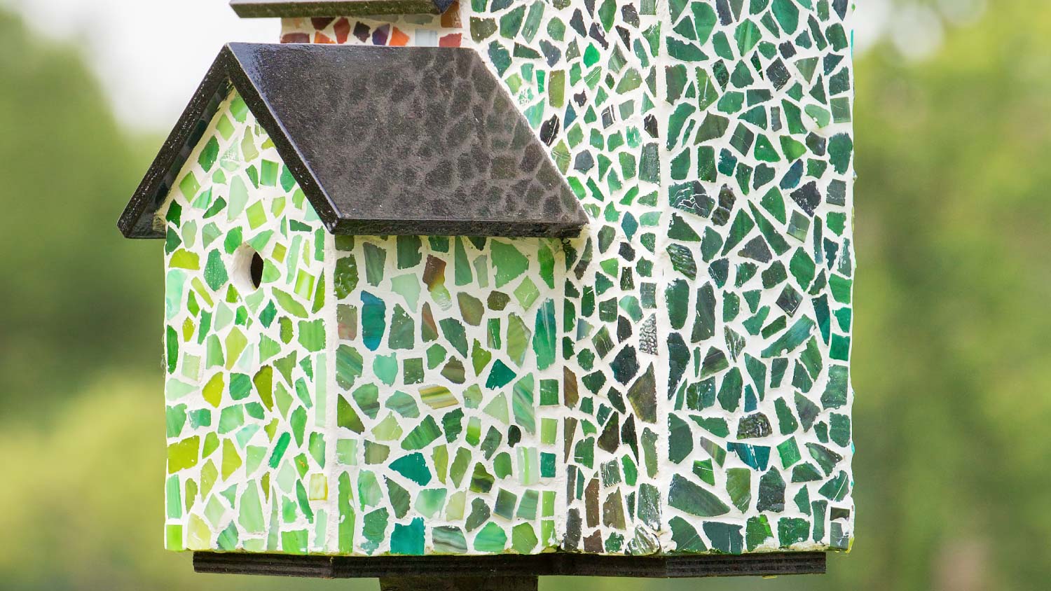 birdhouse made from green mosaic pieces