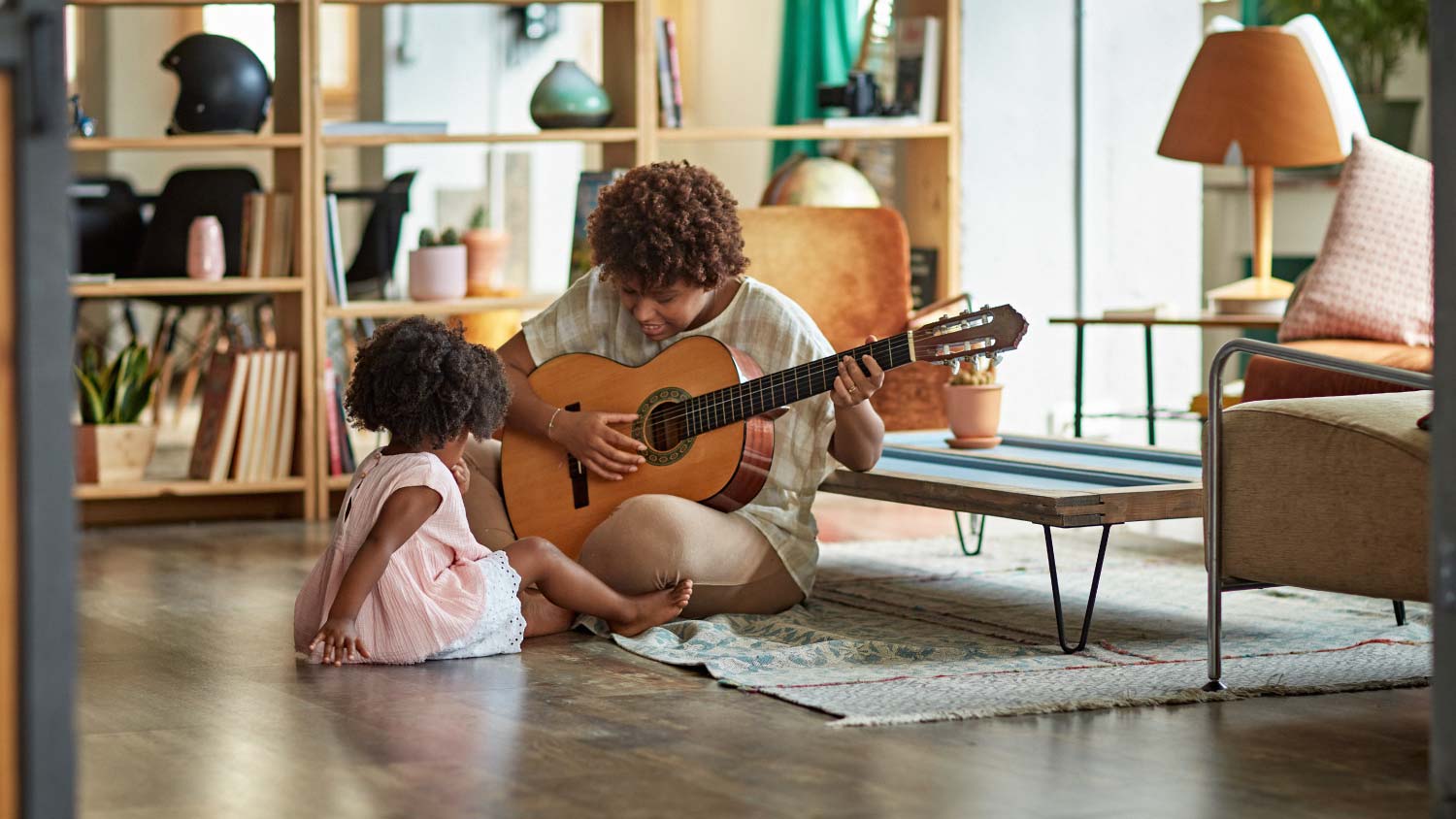 mother and daughter playing guitar