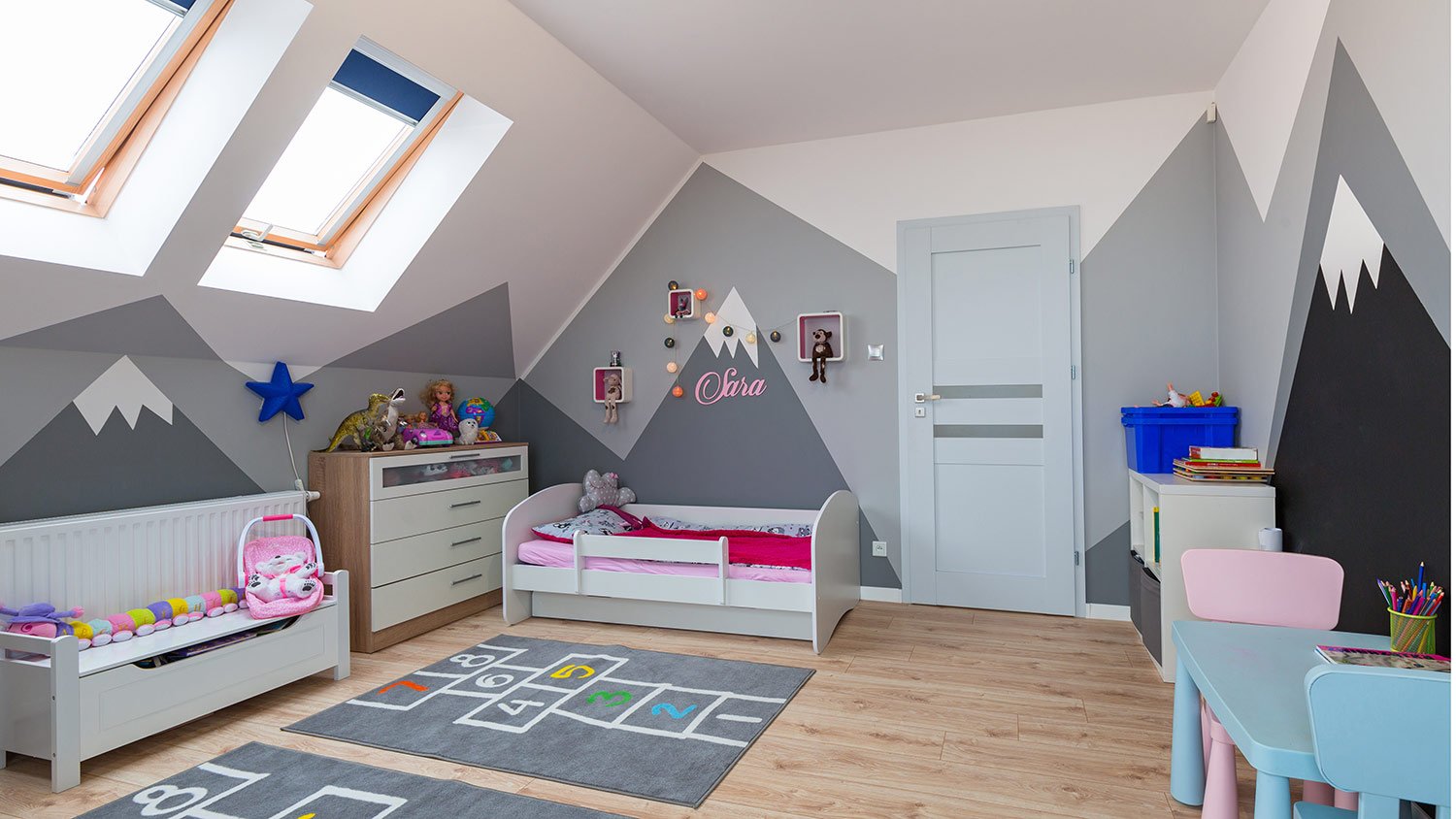 Cute painted child's bedroom with mountains