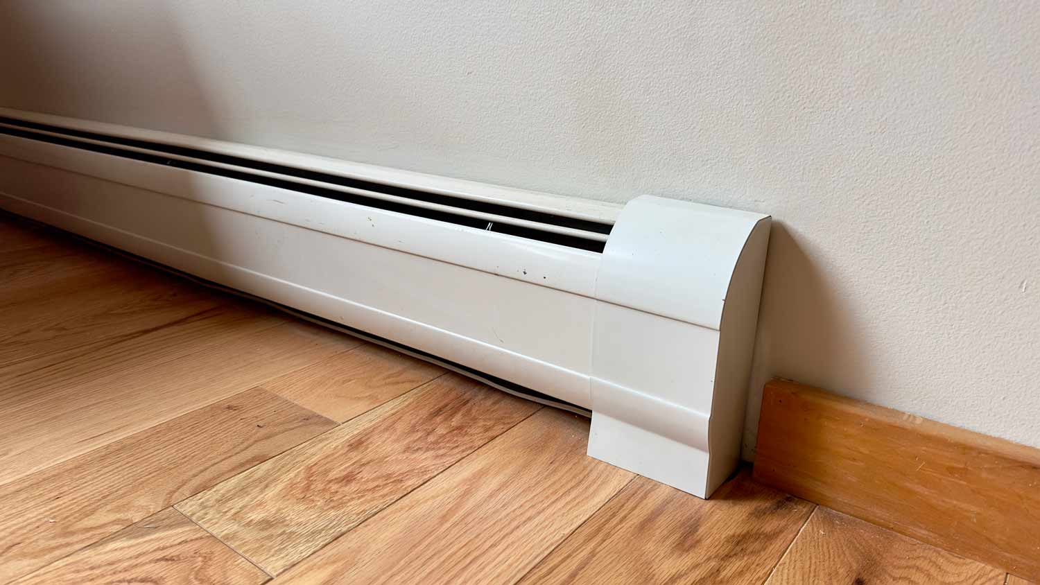 close up of mounted baseboard heater