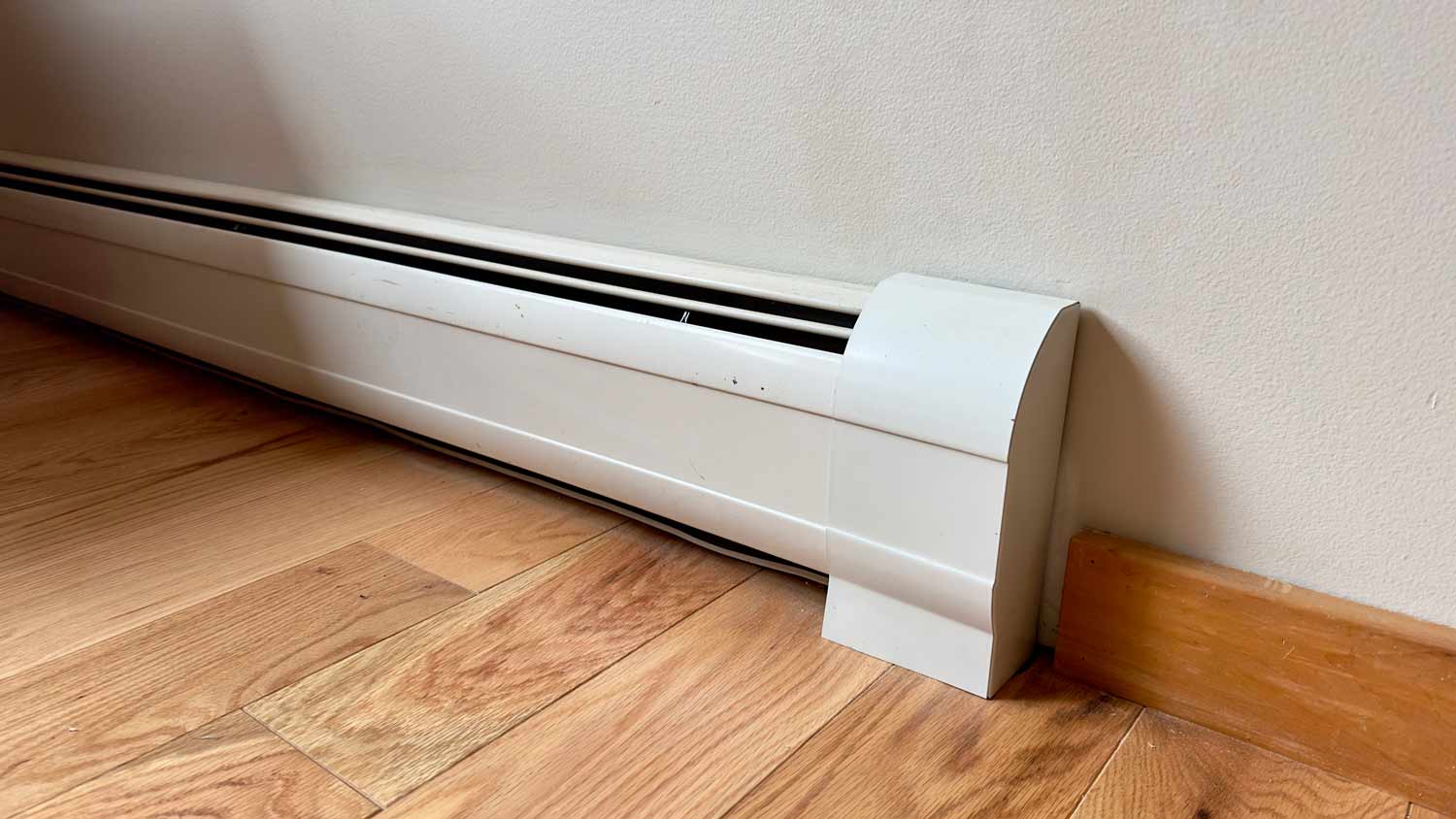 close up of mounted baseboard heater 