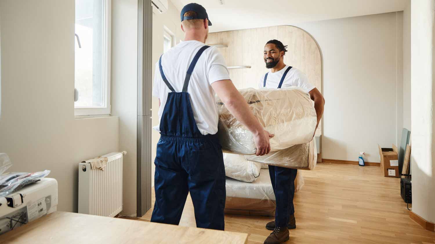 Movers carrying furniture