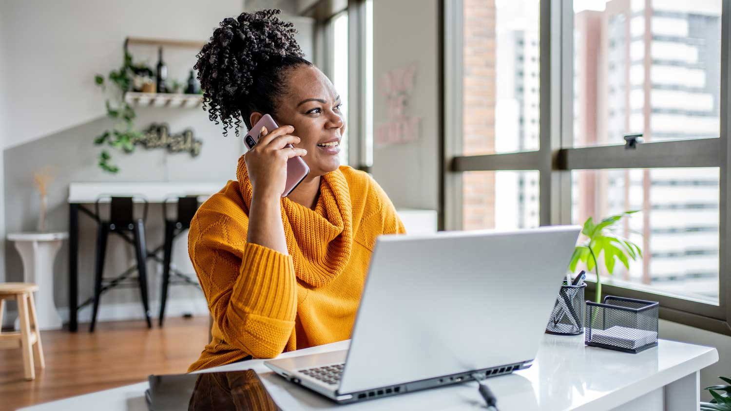 A moving broker talking on her phone