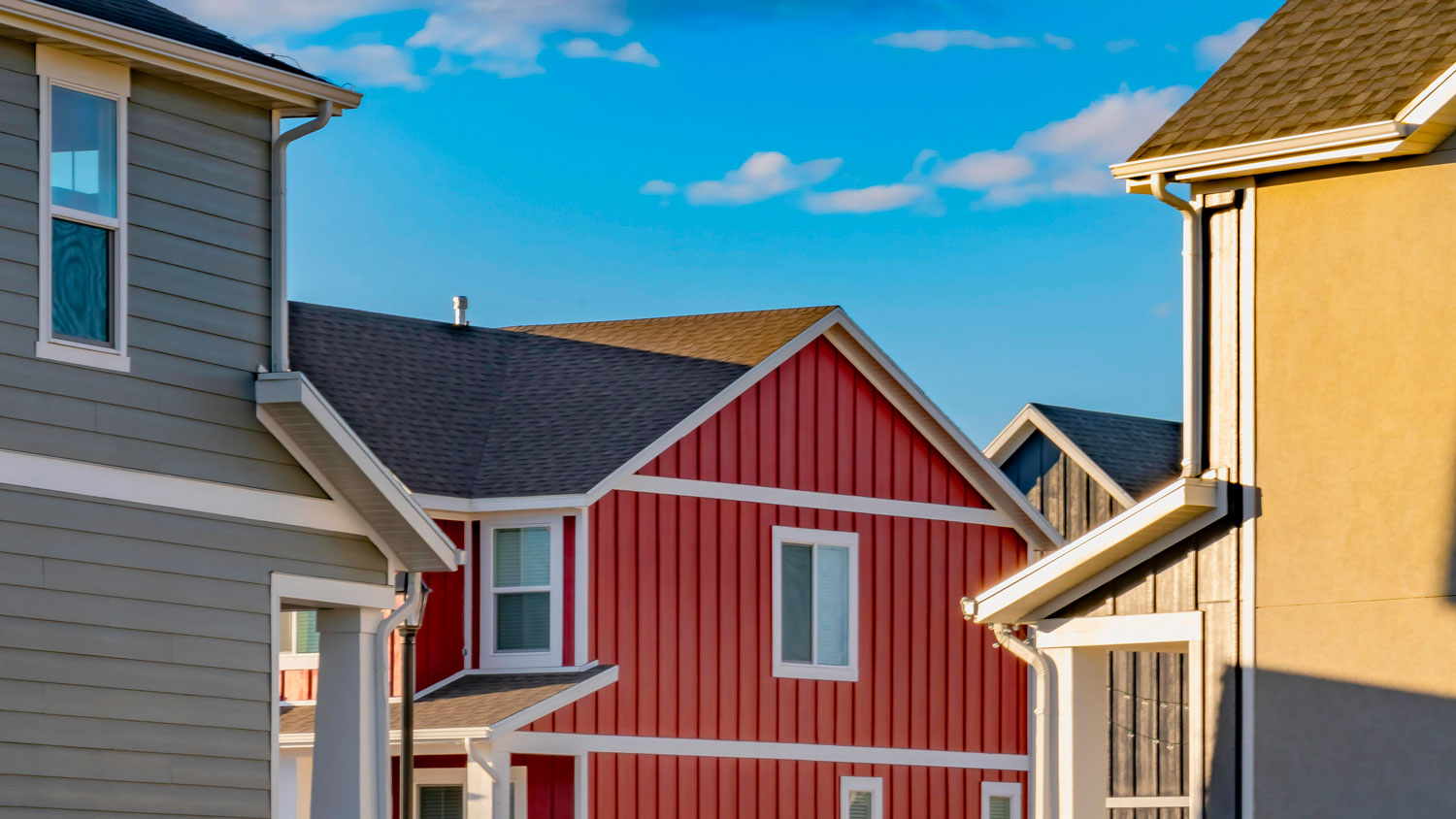 Multiple houses with different color siding.