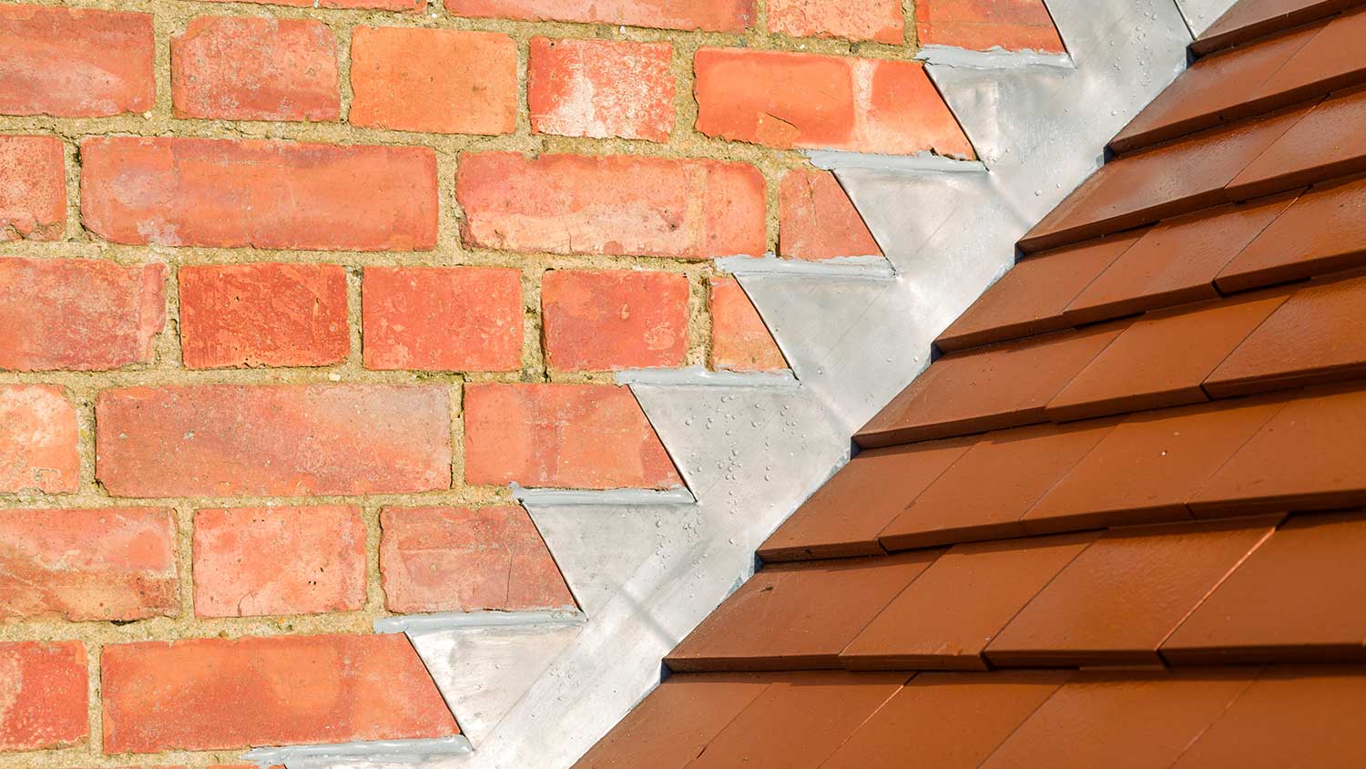 L-shaped flashing on a brick wall