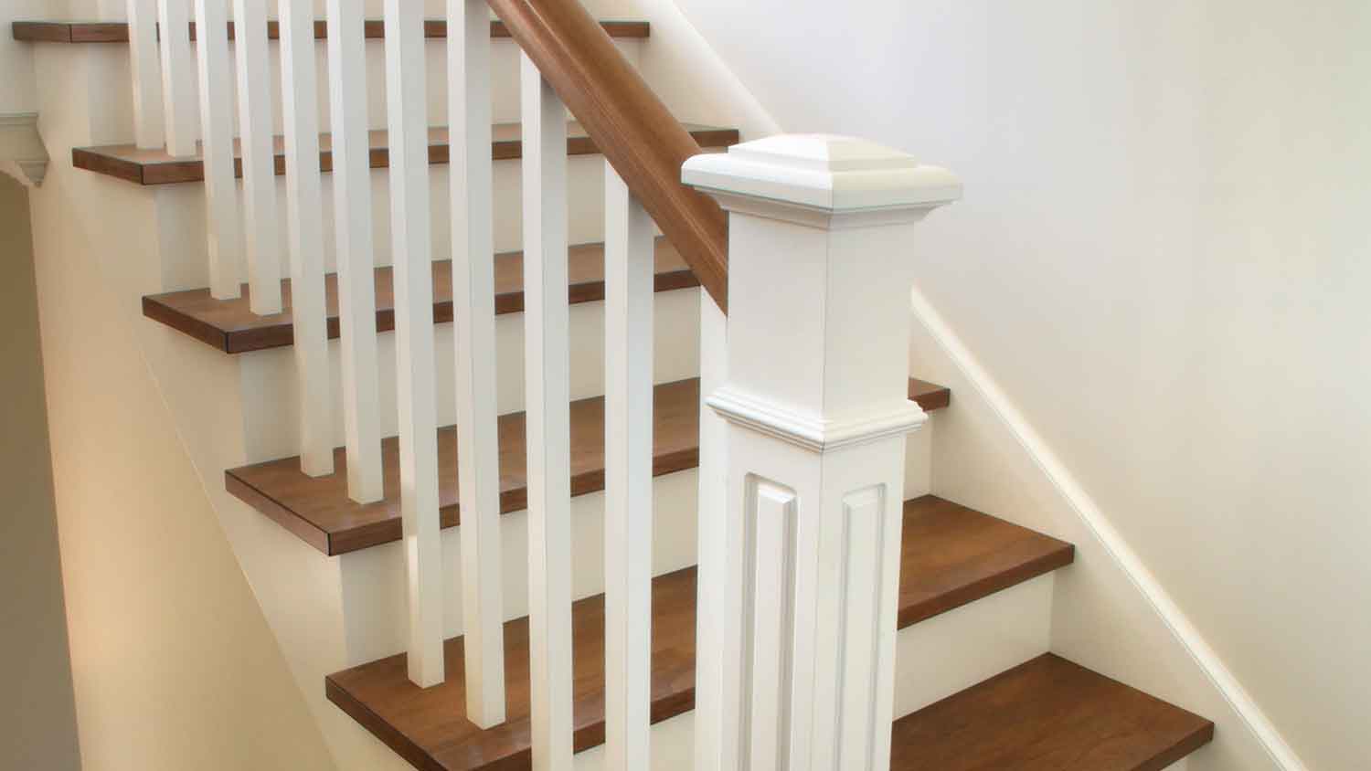 White newel post cap installed on the staircase