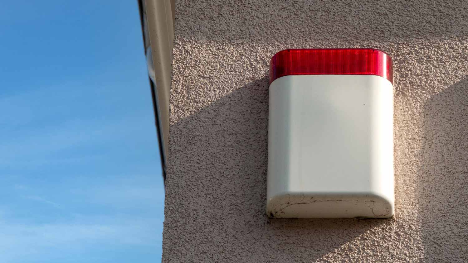 An old house alarm on the exterior of a house