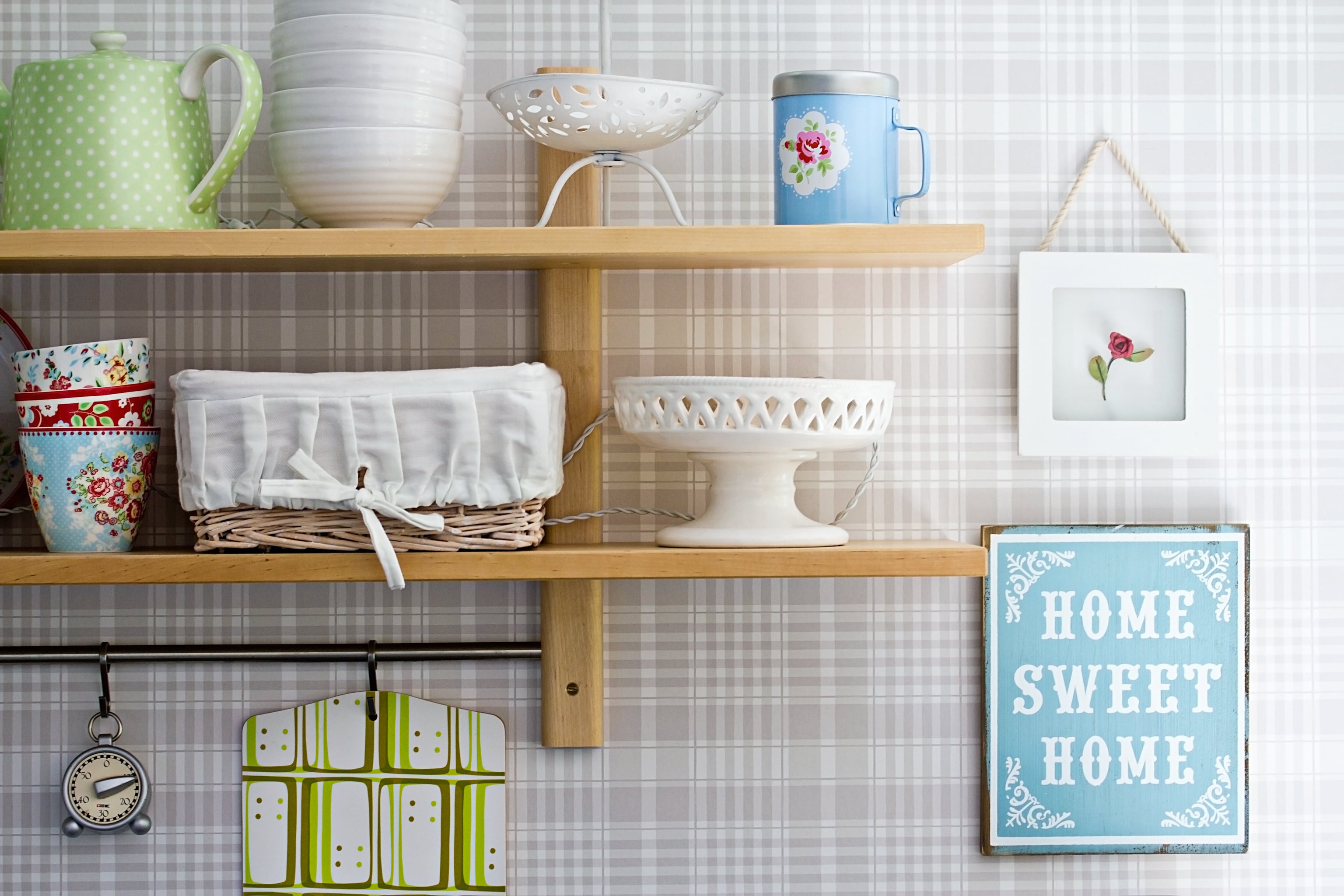 Dish drying metal rack with big nice white clean kitchenware. Traditional  wall cabinet kitchen Stock Photo by Vladdeep