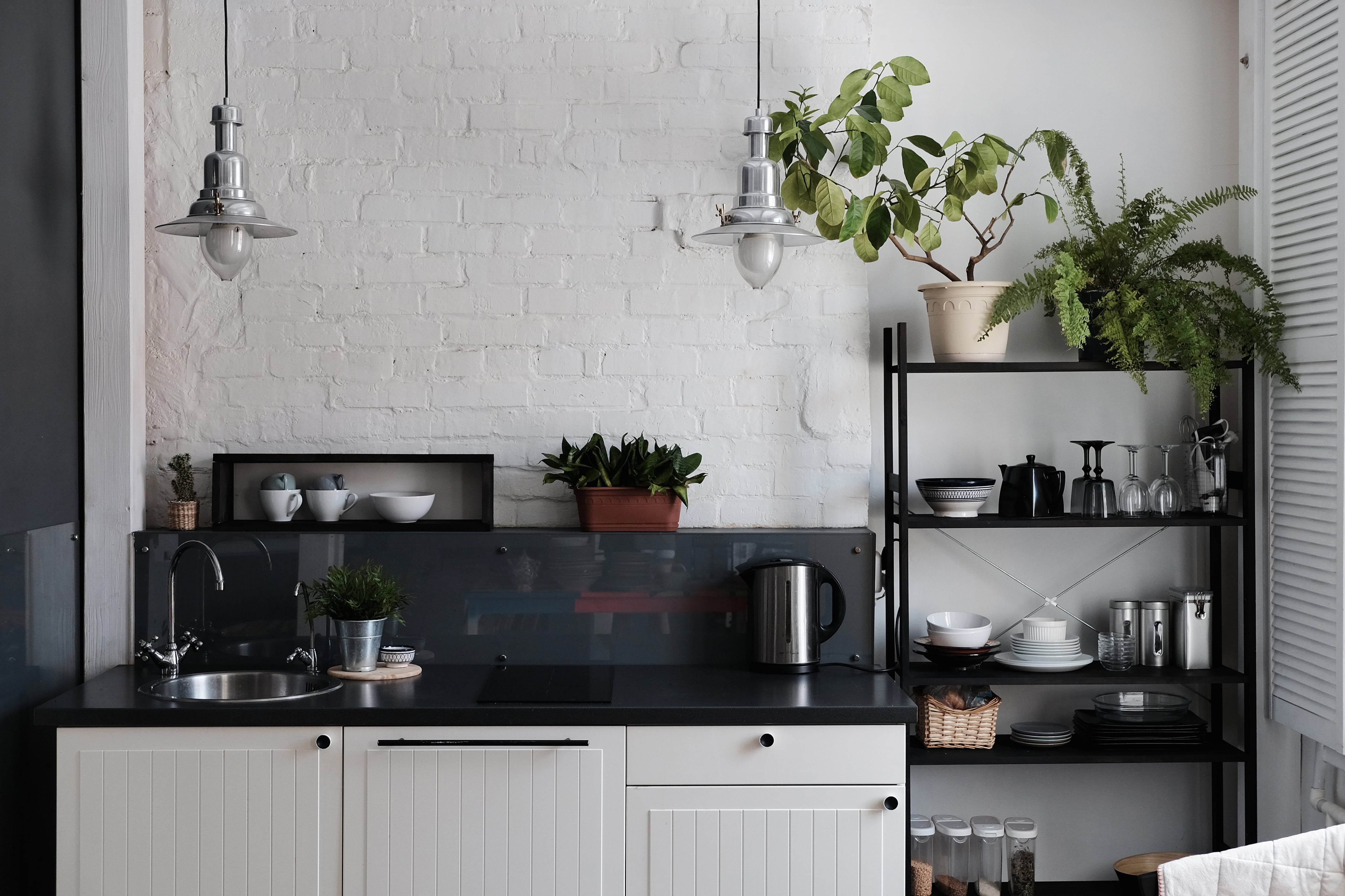 https://media.angi.com/s3fs-public/open-kitchen-shelving-ideas-bakers-rack.jpeg?impolicy=leadImage