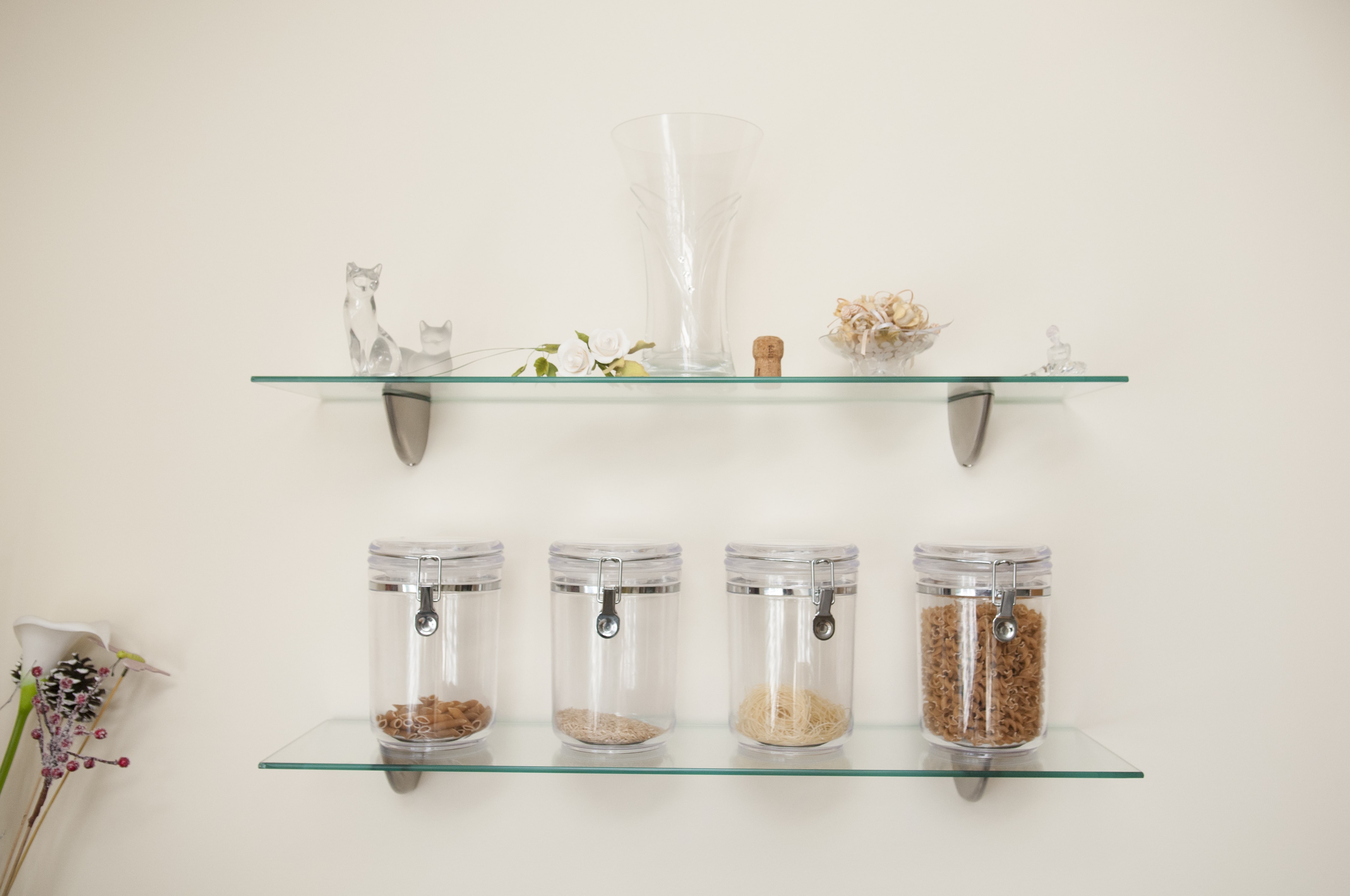 Glass open shelving in kitchen