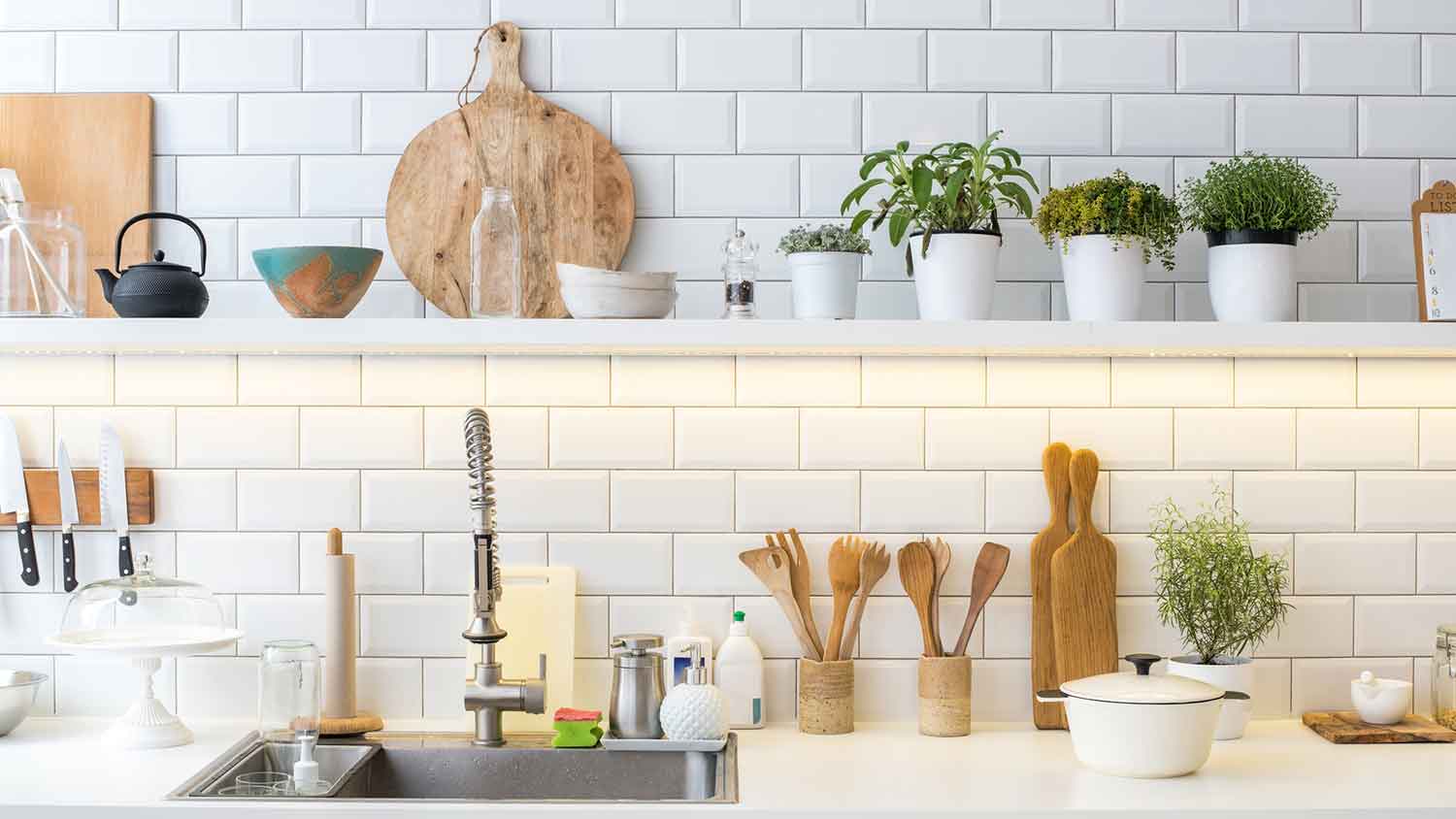 Kitchen with LED lights under open shelves