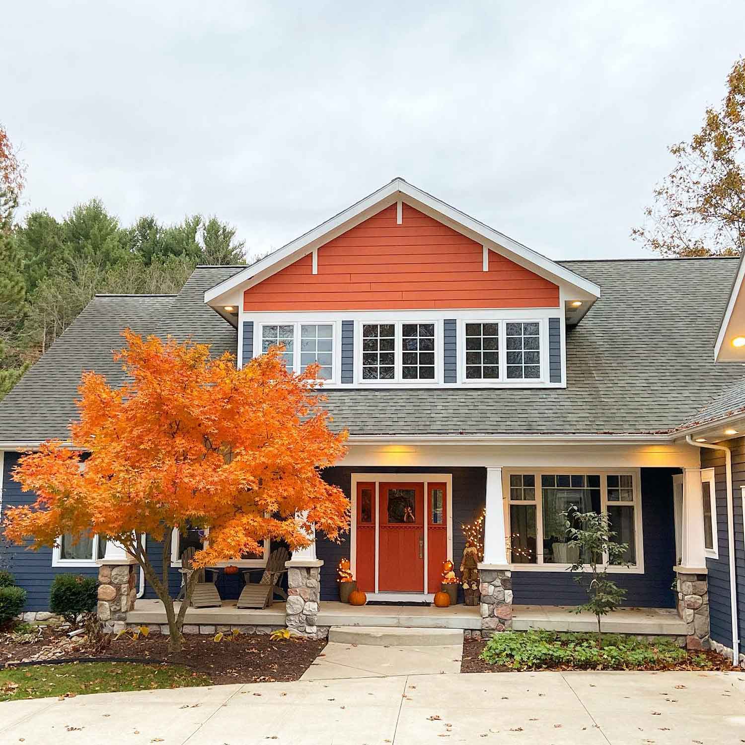 Craftsman home with orange and blue siding 