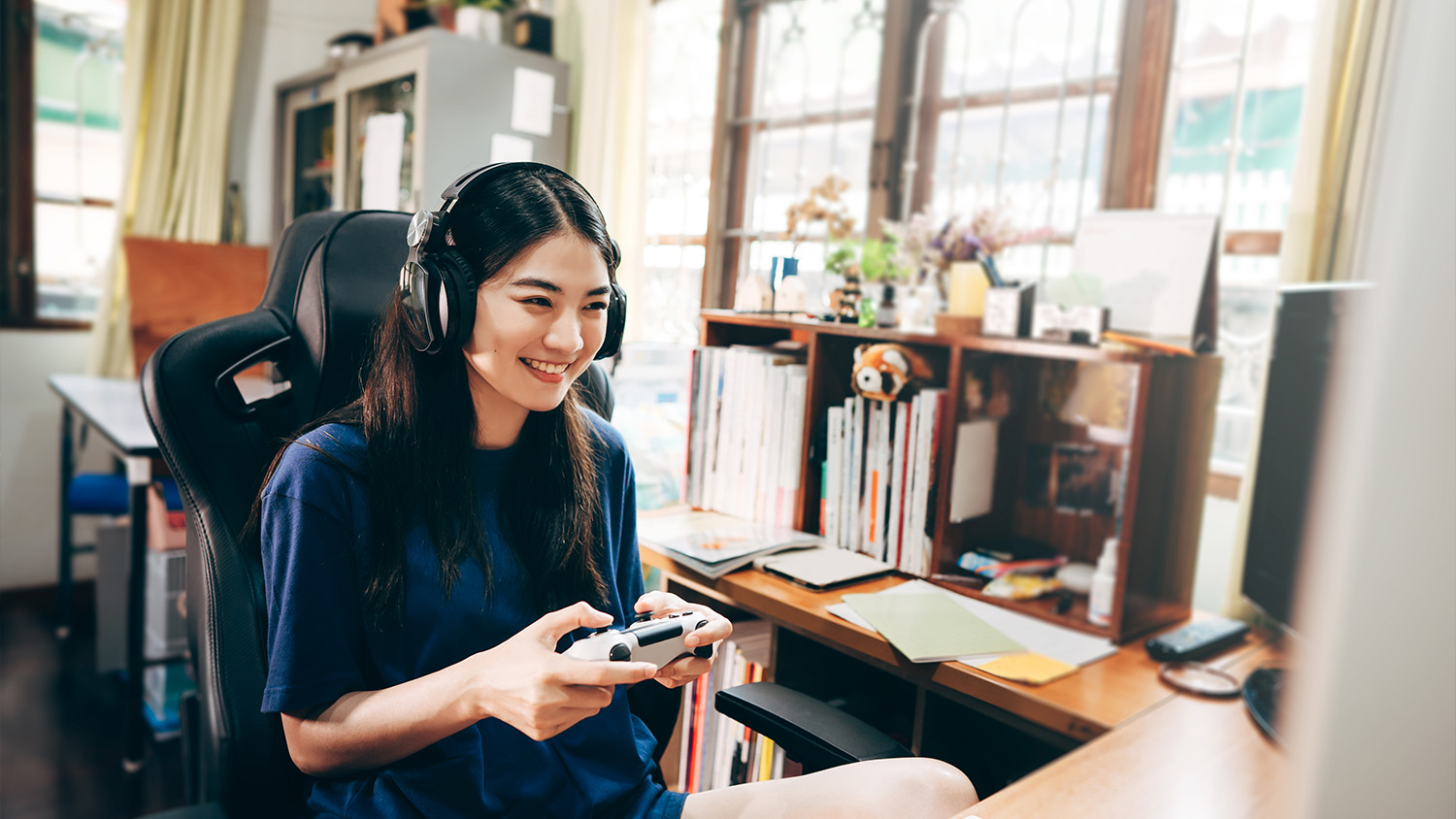 woman in chair playing video game