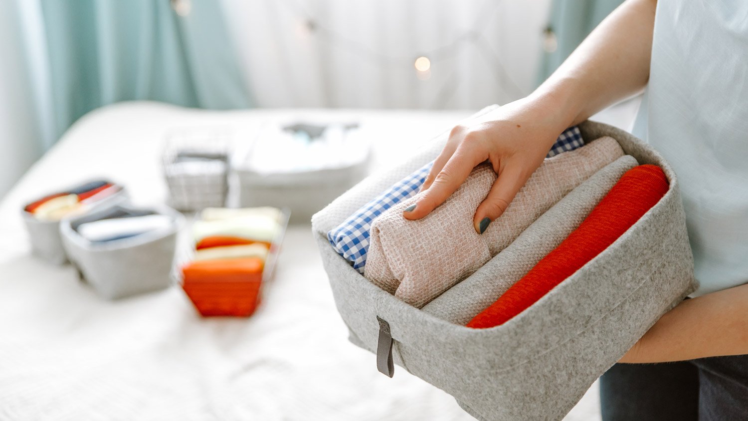 Woman organizing clothes into boxes