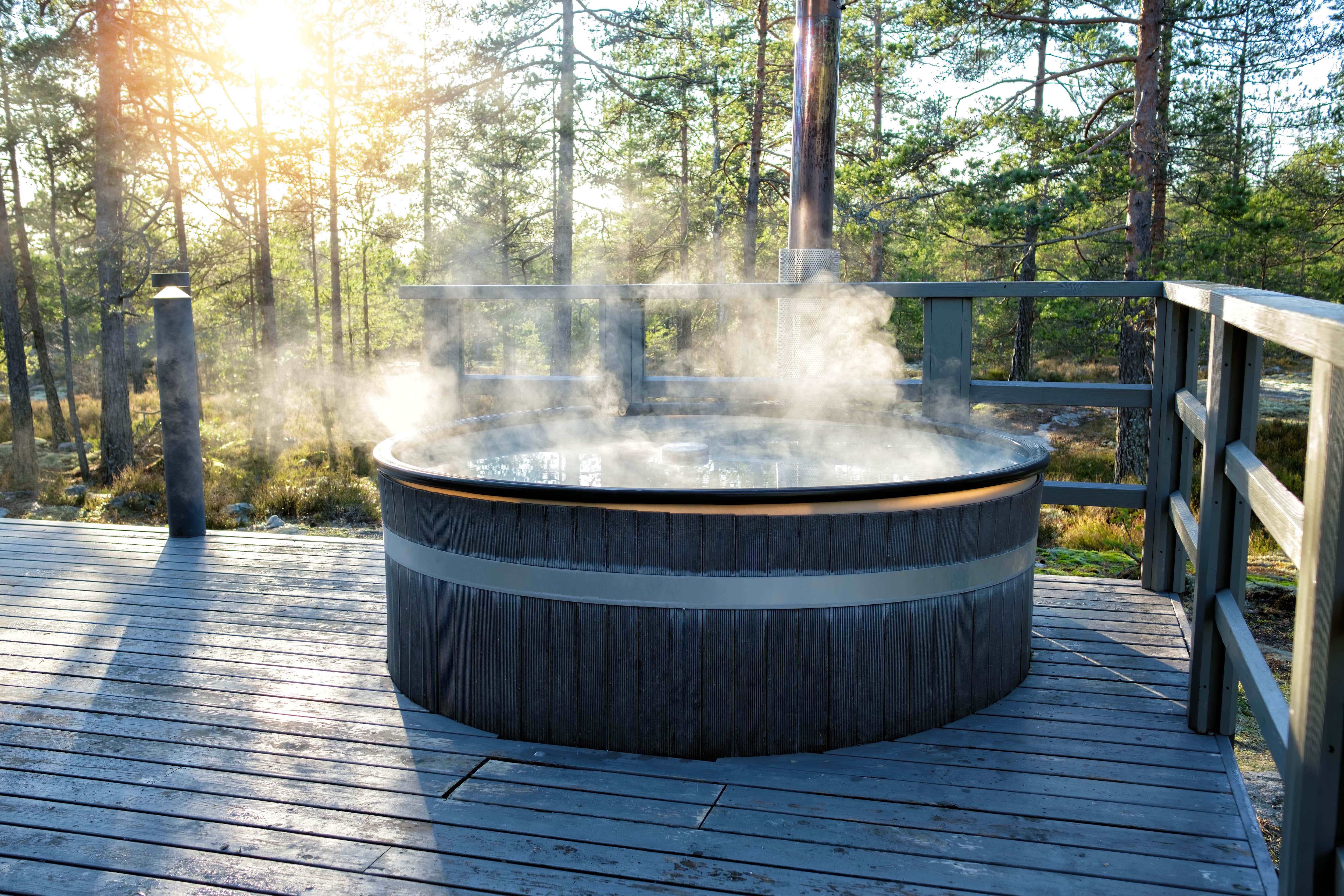 Hot tub and chairs on backyard deck