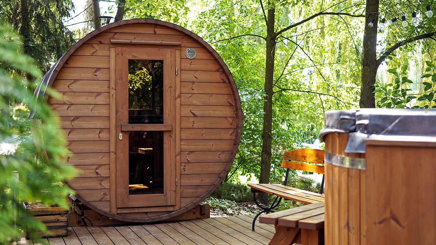 Wooden barrel sauna in the yard