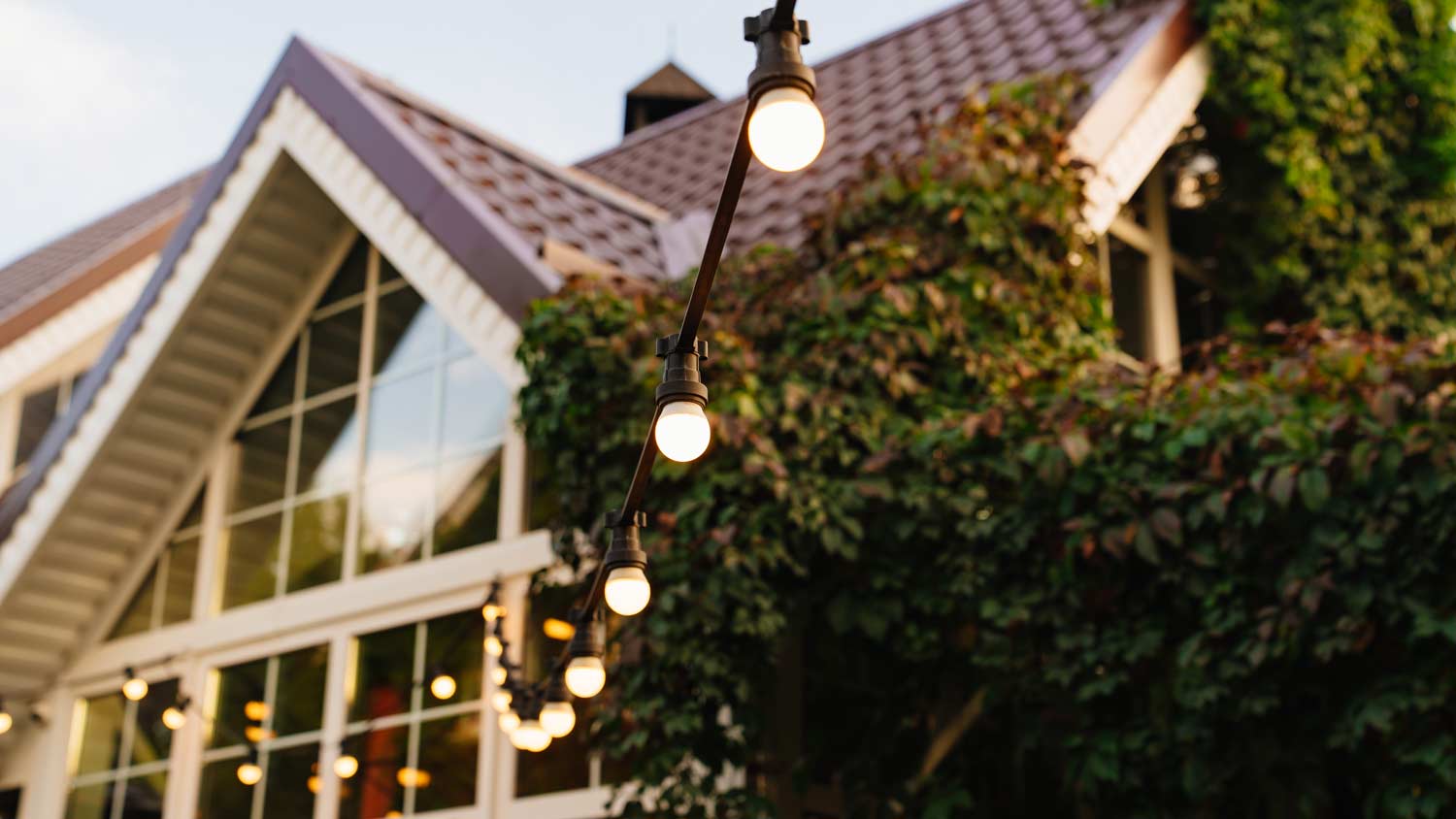  garland of string lights outside country house 