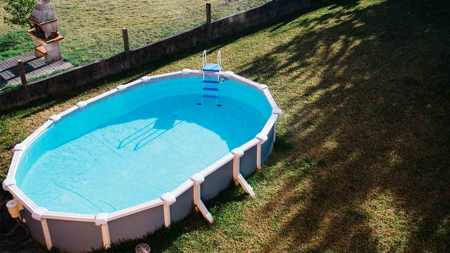 oval above ground swimming pool yard