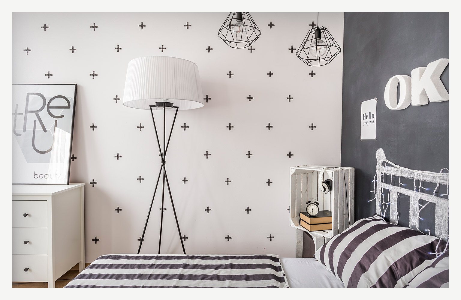 black plus signs patterned wall in bedroom