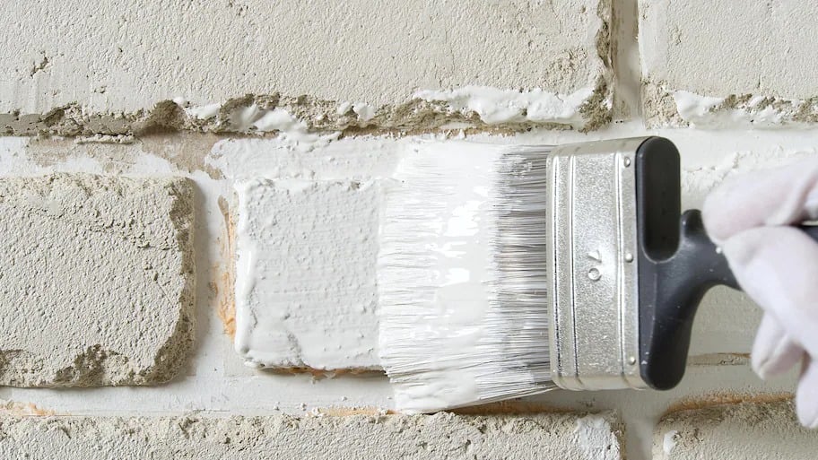 Painting brick white with paintbrush