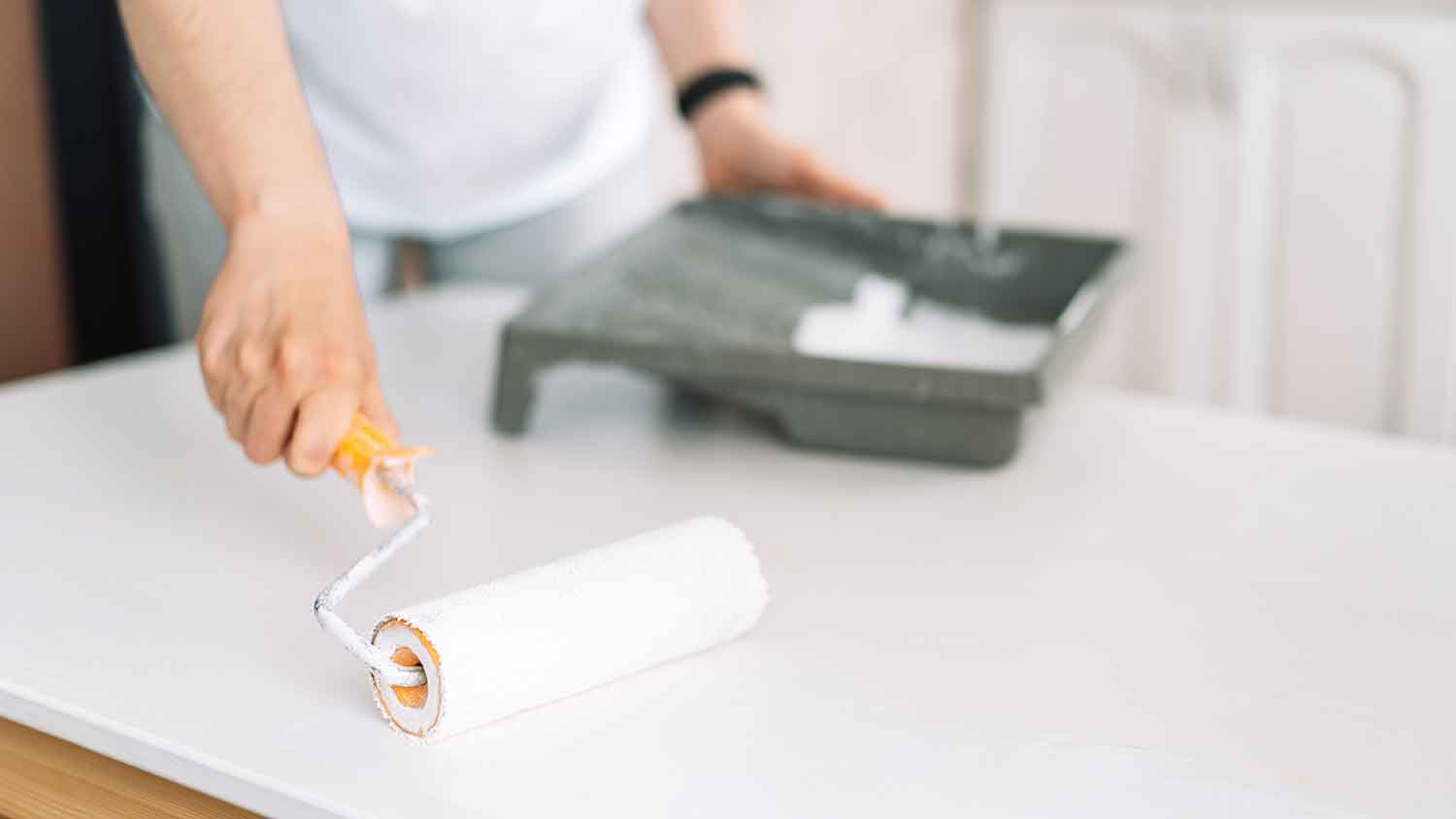 Painting countertop with a roller