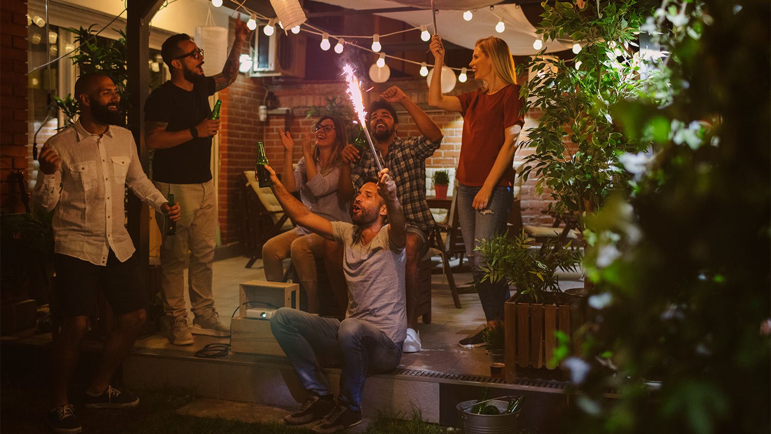 Group partying outside in backyard