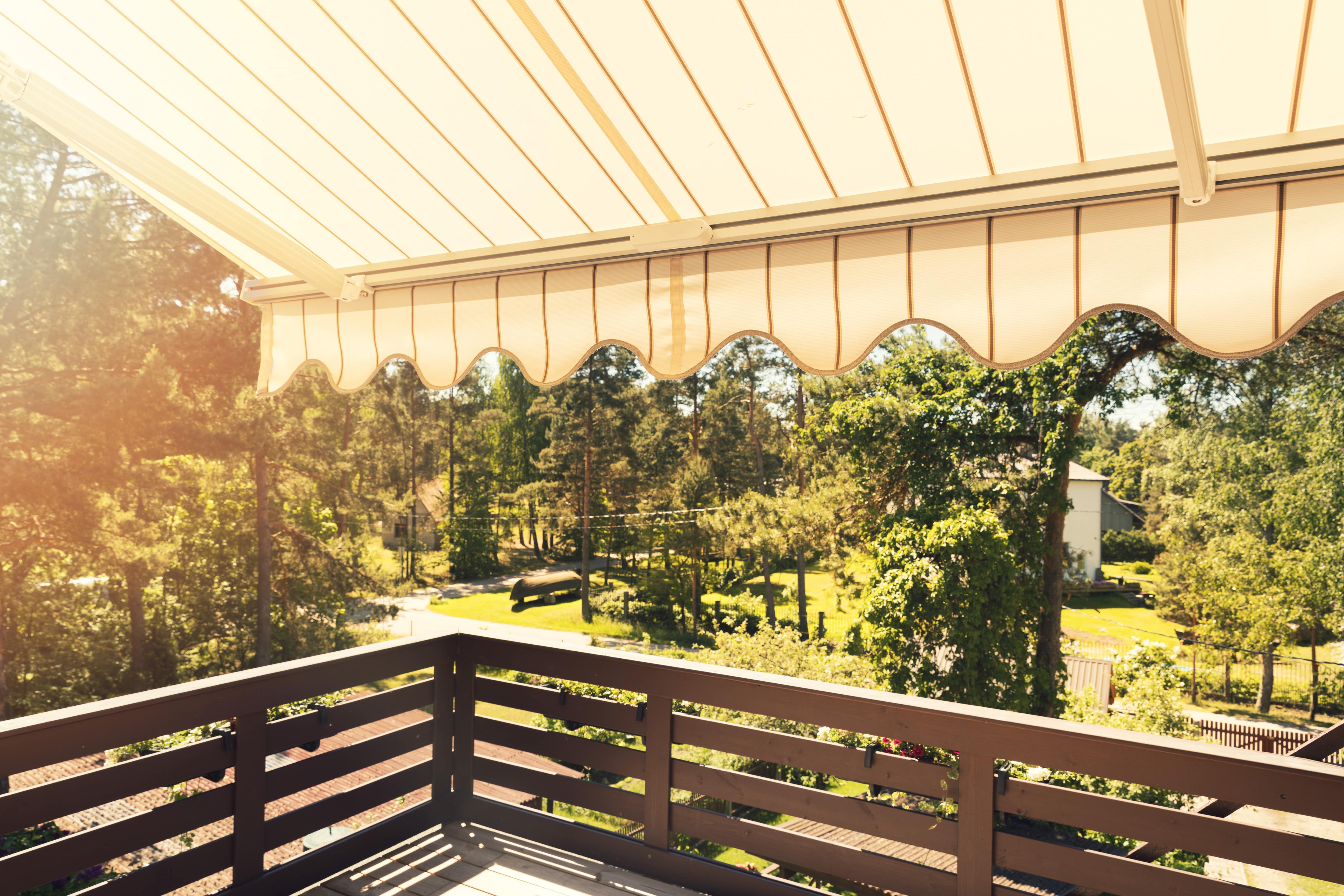 A brown and yellow retractable awning 