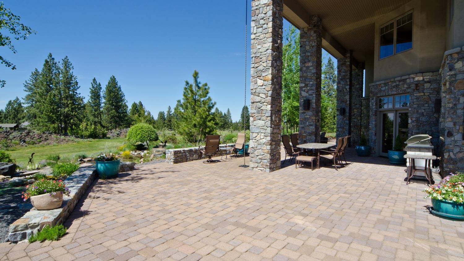 A large patio with flagstone and great views