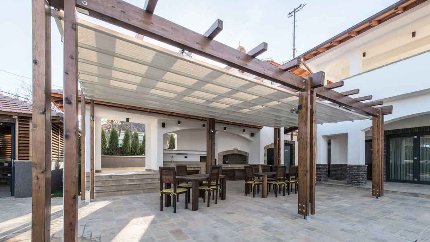 Large summer kitchen with wooden pergola