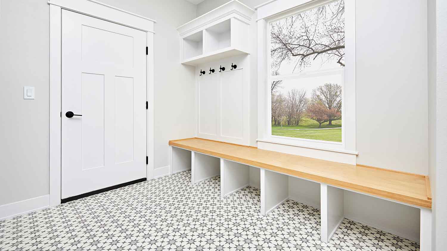 Modern mudroom with patterned tiled floor